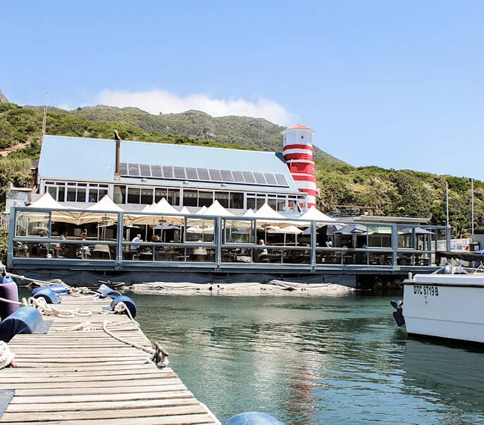 The Lookout and its lighthouse seen from the jetty across the water