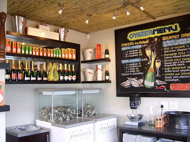 The oyster bar, with its chalkboard oyster menu and bubbly in the fridge