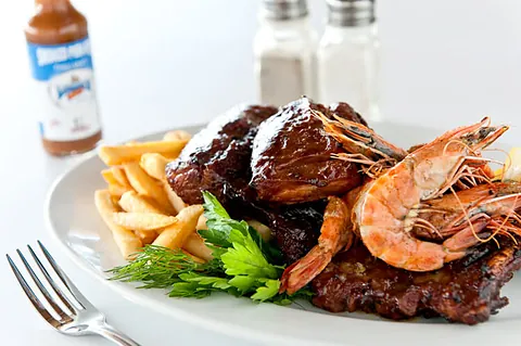 BBQ pork ribs and grilled prawns with chips