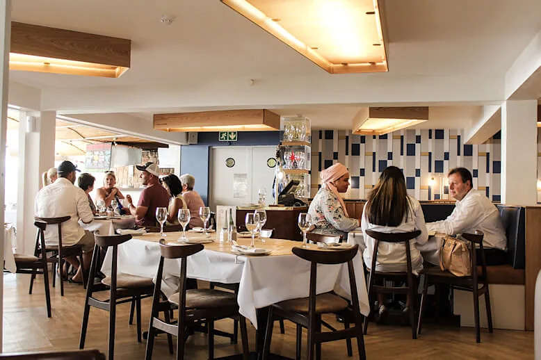 Guests at lunch in the bright dining room